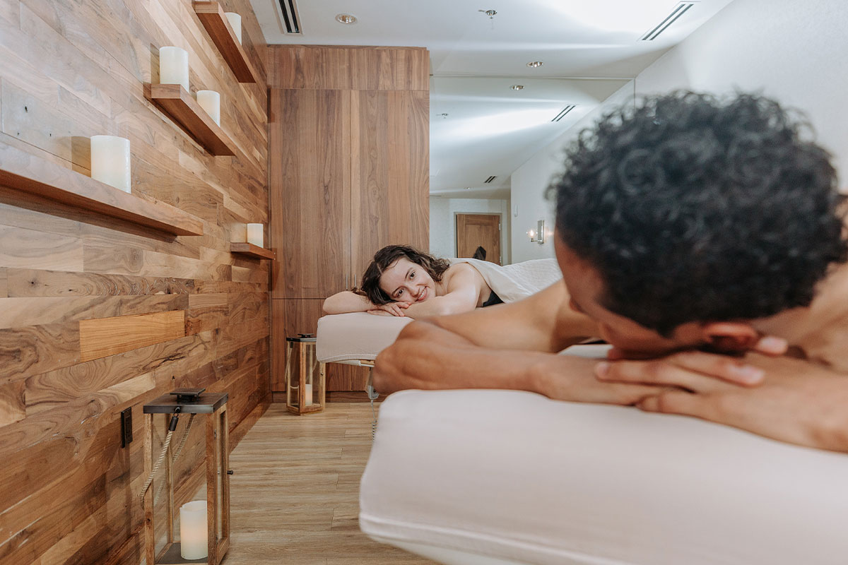 Two people relax during massage treatments in Aurora, Colorado