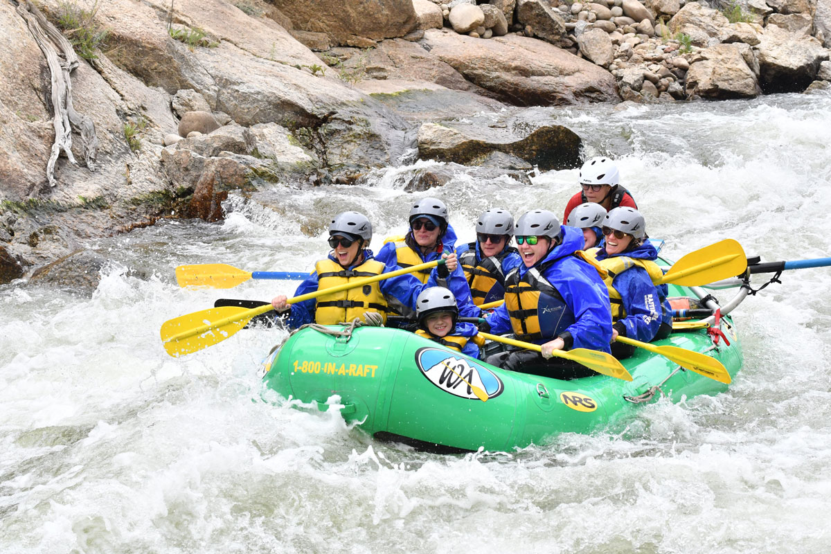 A group of rafters paddle through whitewater in Lower Browns Canyon on the Arkansas River.