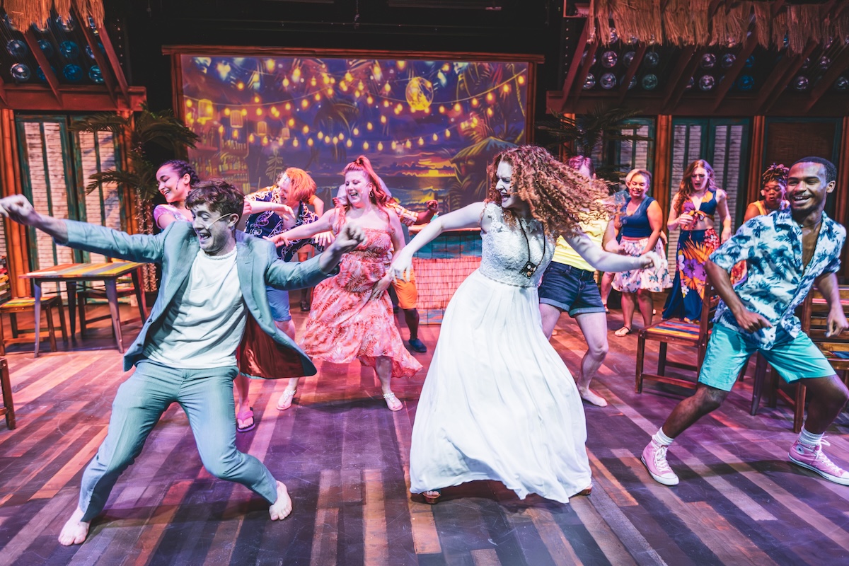 Actors dance across the stage during a colorful performance at Thingamajig Theatre Company in Pagosa Springs, Colorado.