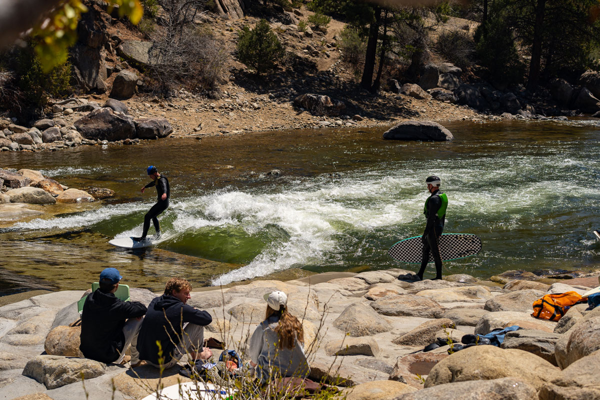 A river surfer rides a wave in Buena Vista