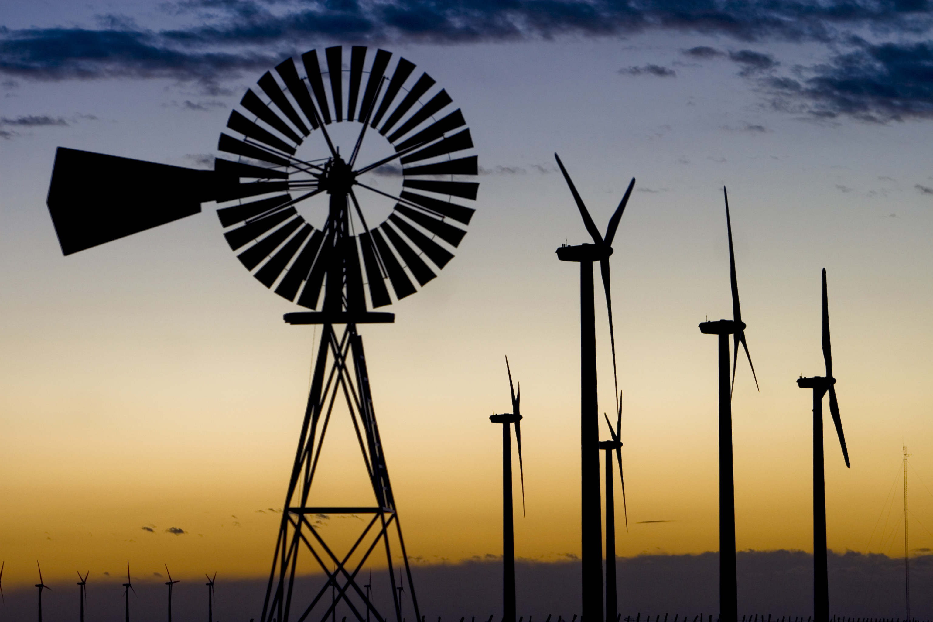 An oldstyle windmill among the newer energygenerating models near
