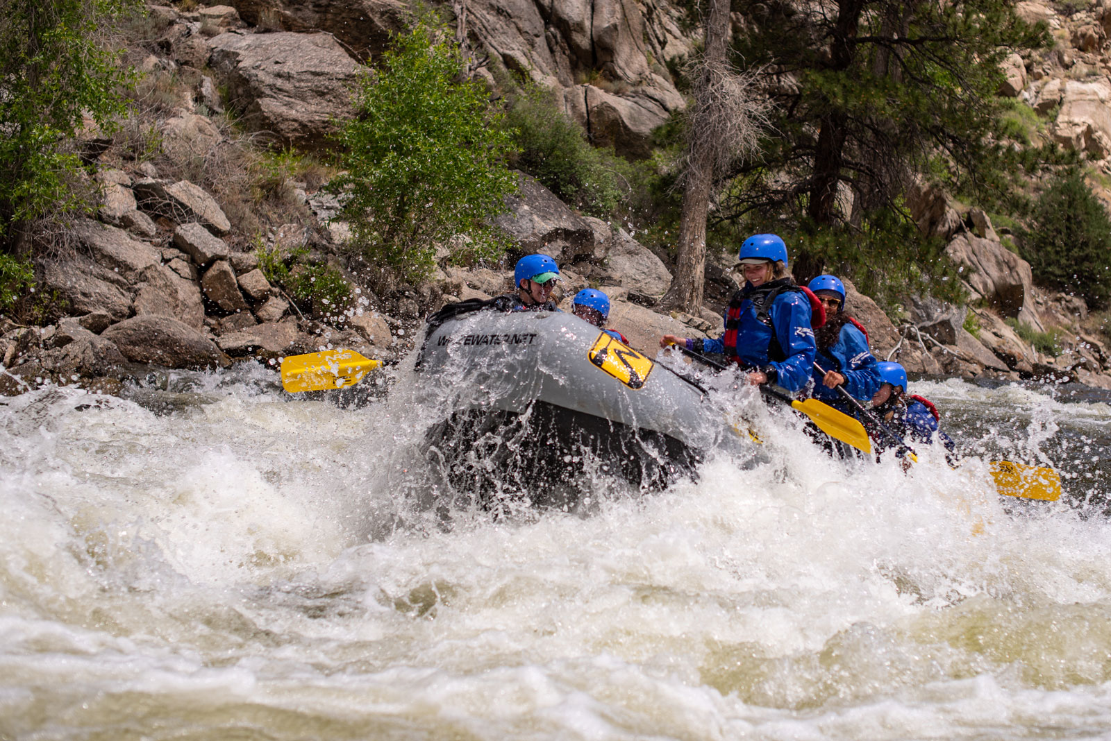A raft navigates massive whitewater 