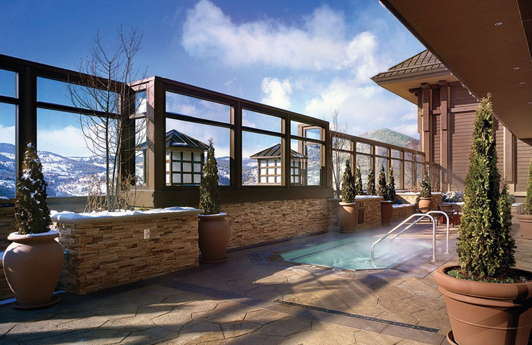 A steamy pool on the rooftop patio