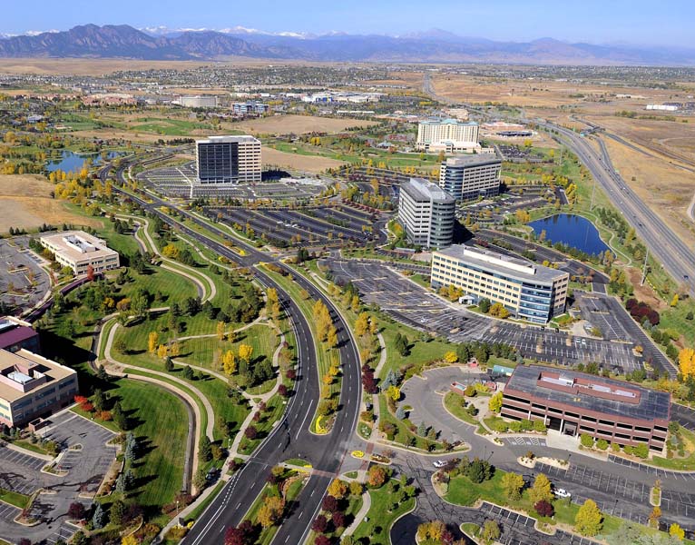 An aerial shot of Broomfield in the summer with office buildings and freshly paved roads.