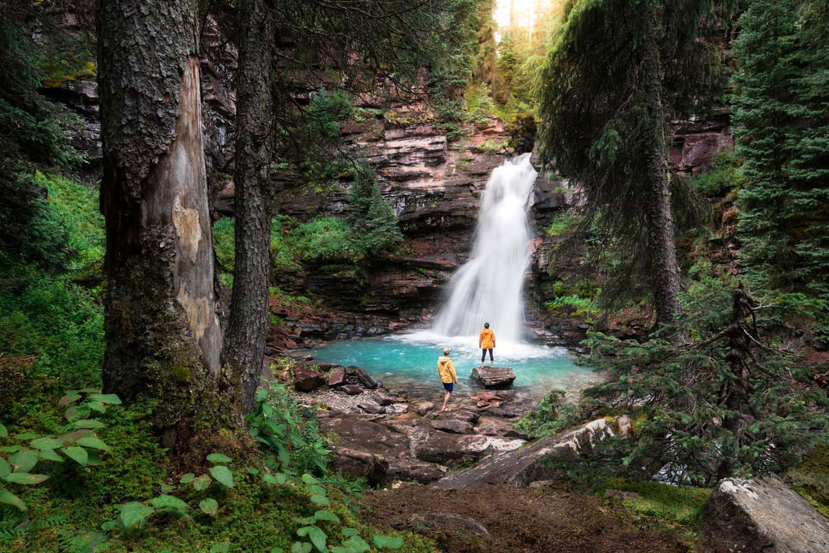  People watch water cascade into a bright blue South Mineral Creek Falls near Durango