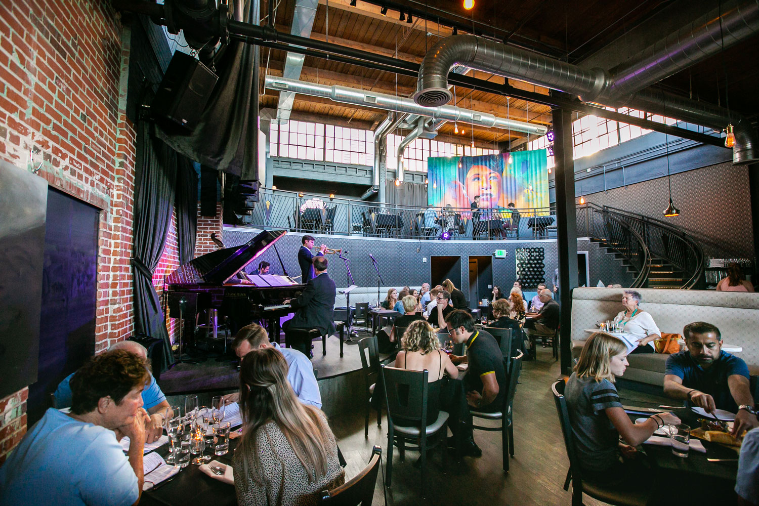 Live music is played inside a restaurant full of diners