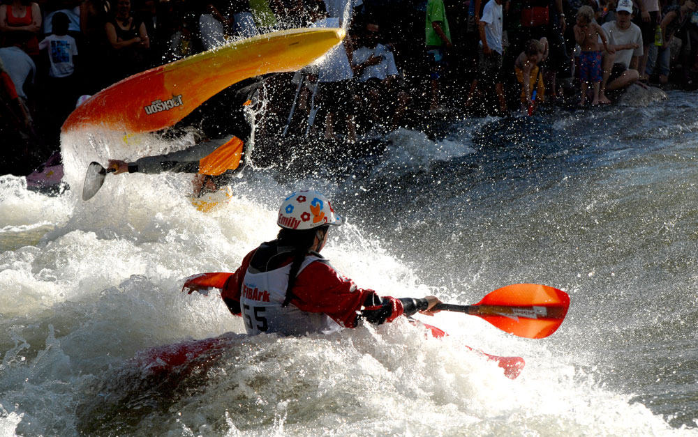 kayakers flipping in the whitewater kayaking contest at the FIBark festival in Salida, Colorado