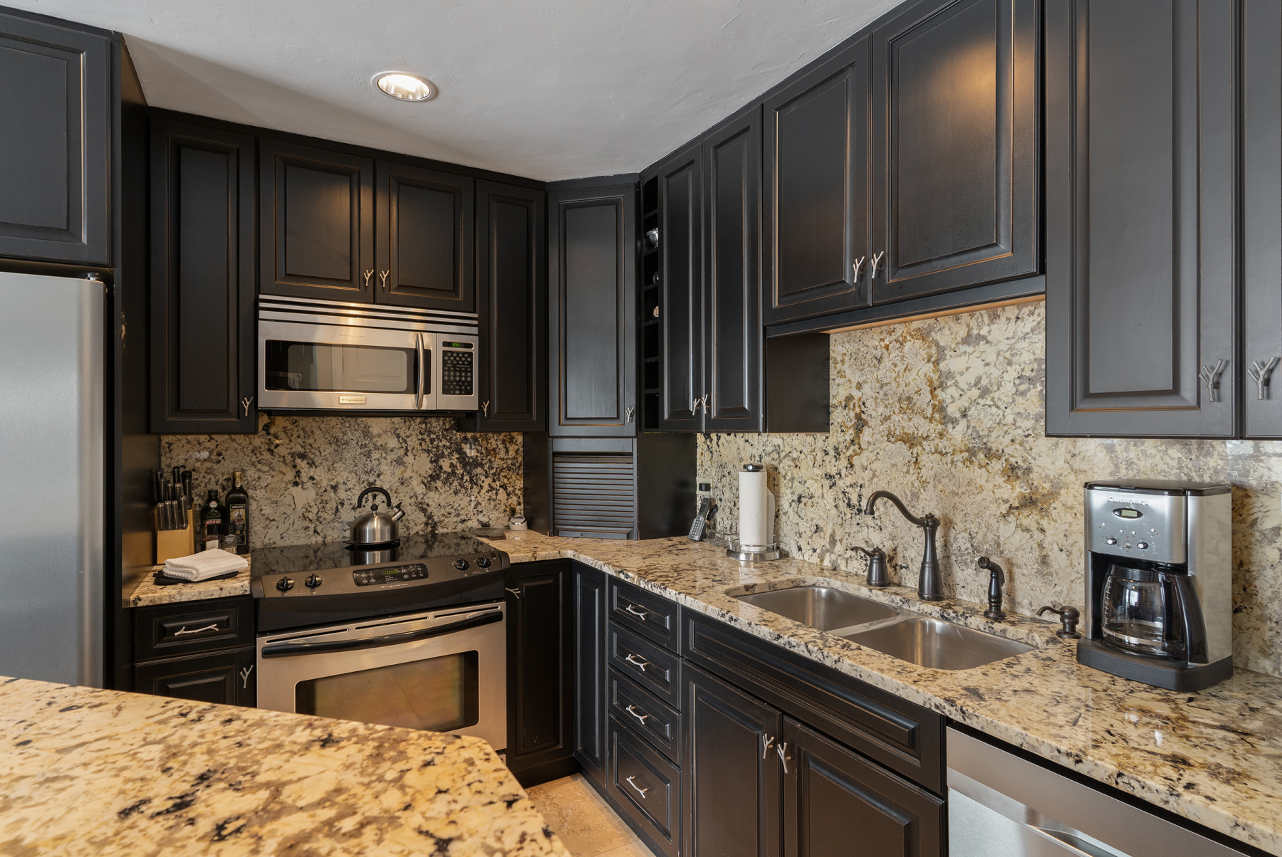 kitchen in a luxury bear claw condo photo 9