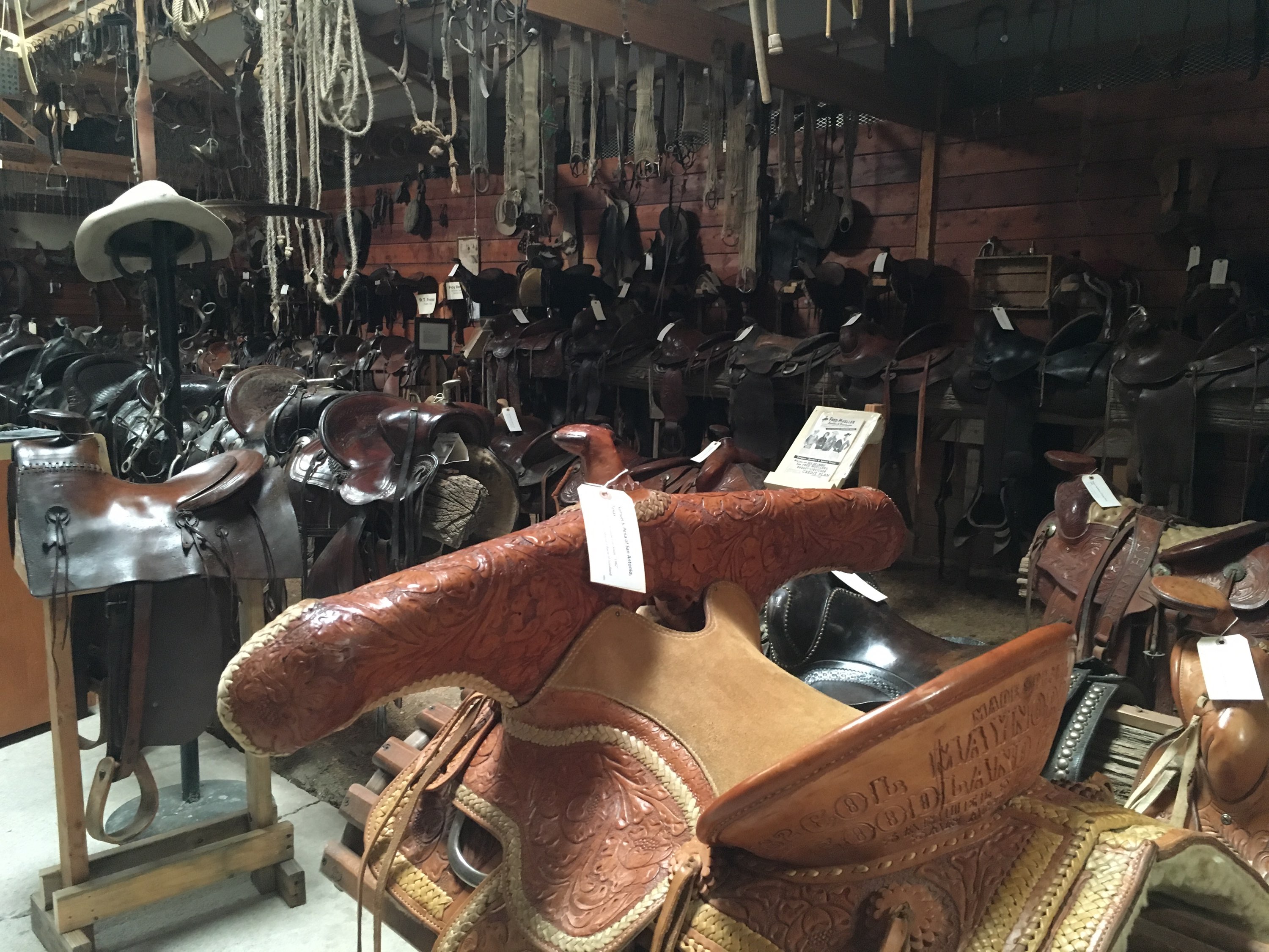 over 400 saddles and old west items also! photo