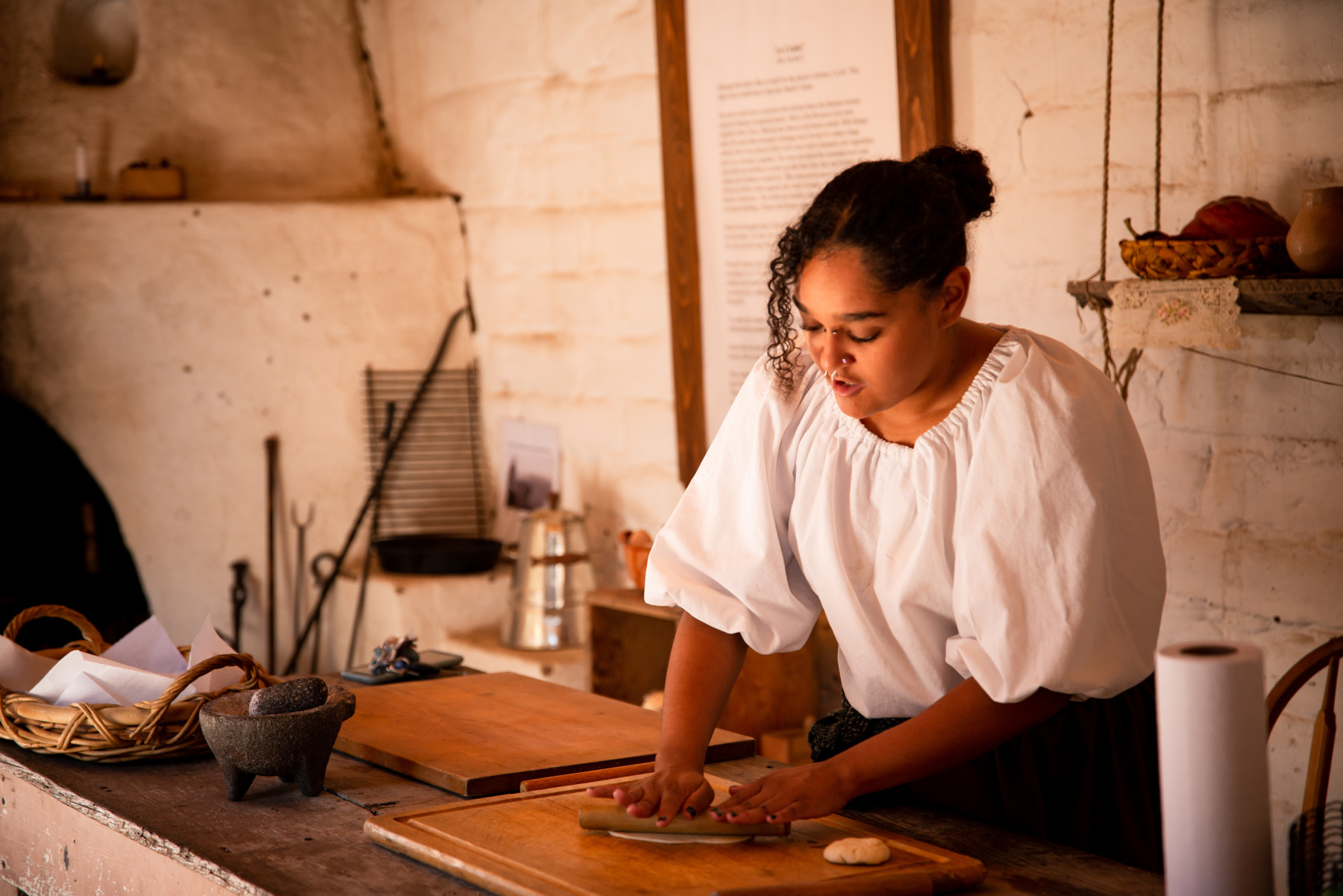 a staff member leads a tortilla-making session at el pueblo history museum photo 2