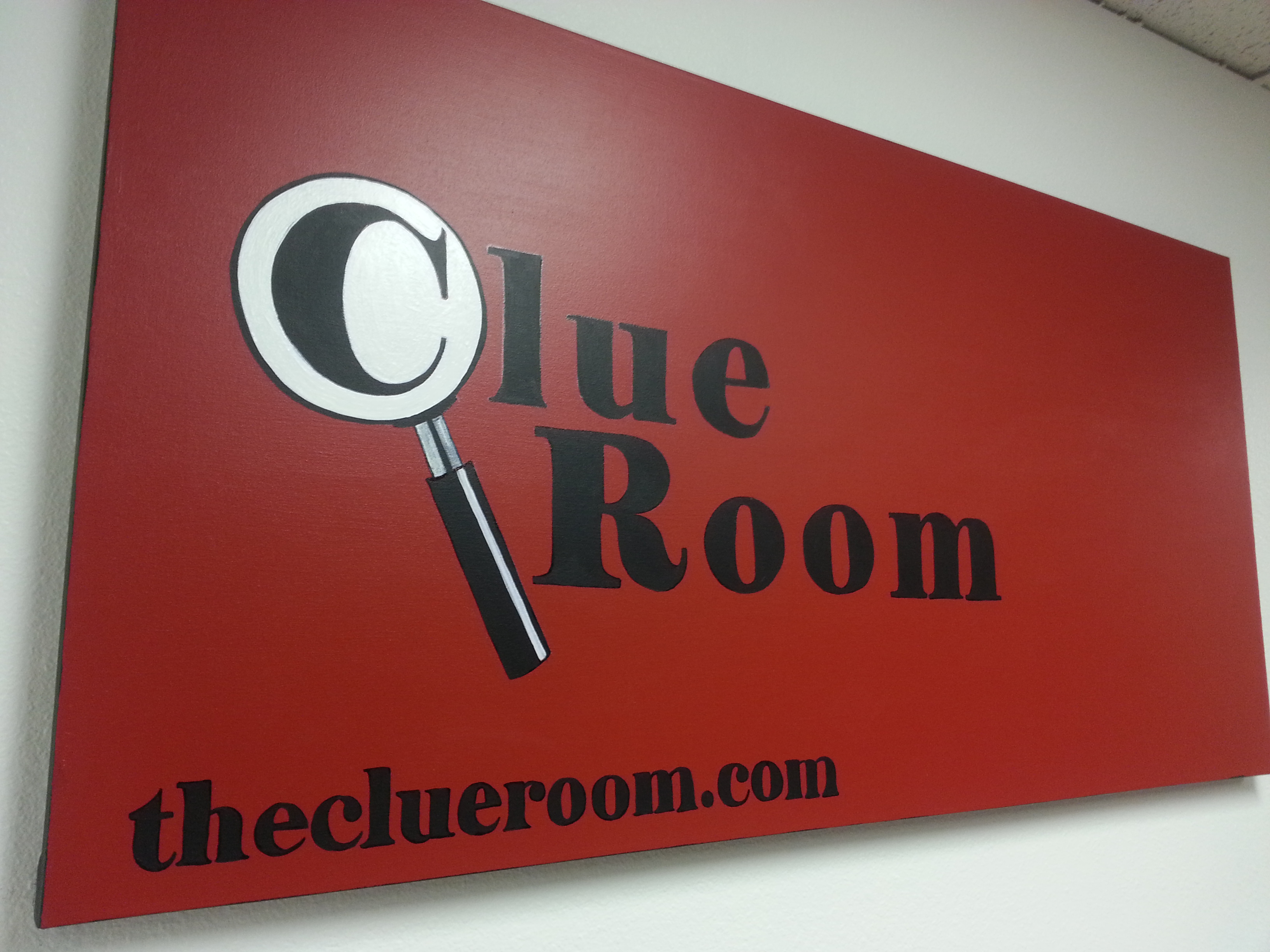 come in, escape, and take a picture with our legendary red logo backdrop made by one of centennial's local artists. photo