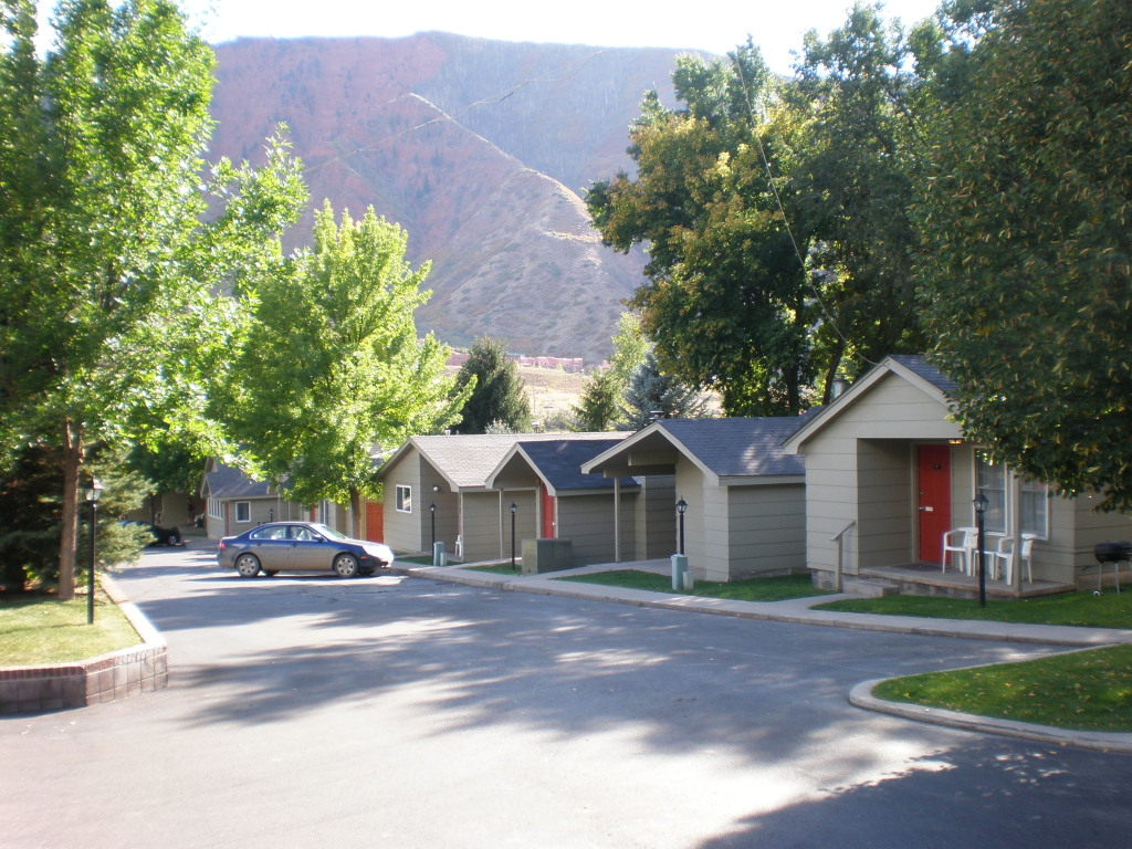 a view of some of our cabins with red mountain in the background photo