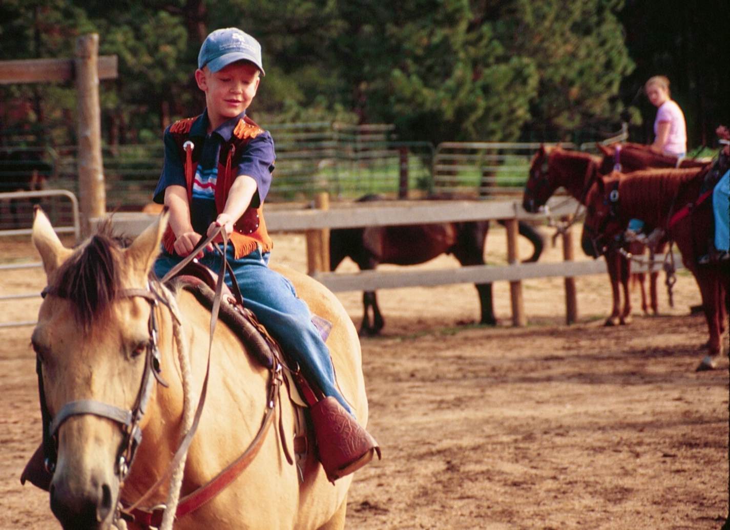 woody teaching david how to steer at sundance trail dude ranch photo