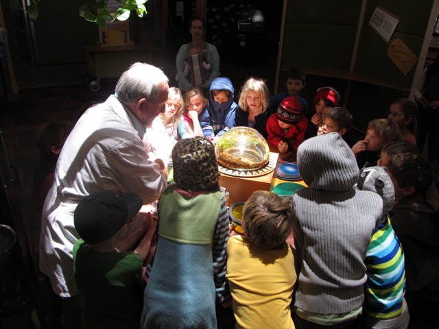 staff member works with youth during field trip photo
