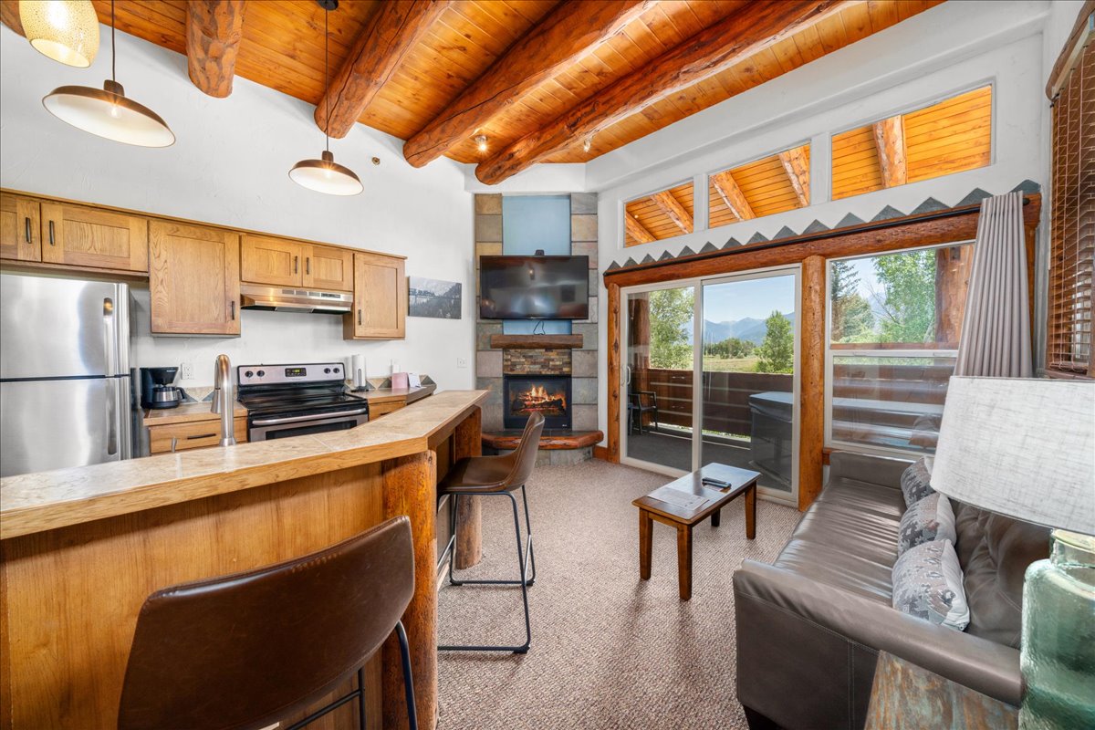 suite-style guest room with private hot tub and fireplace photo 13