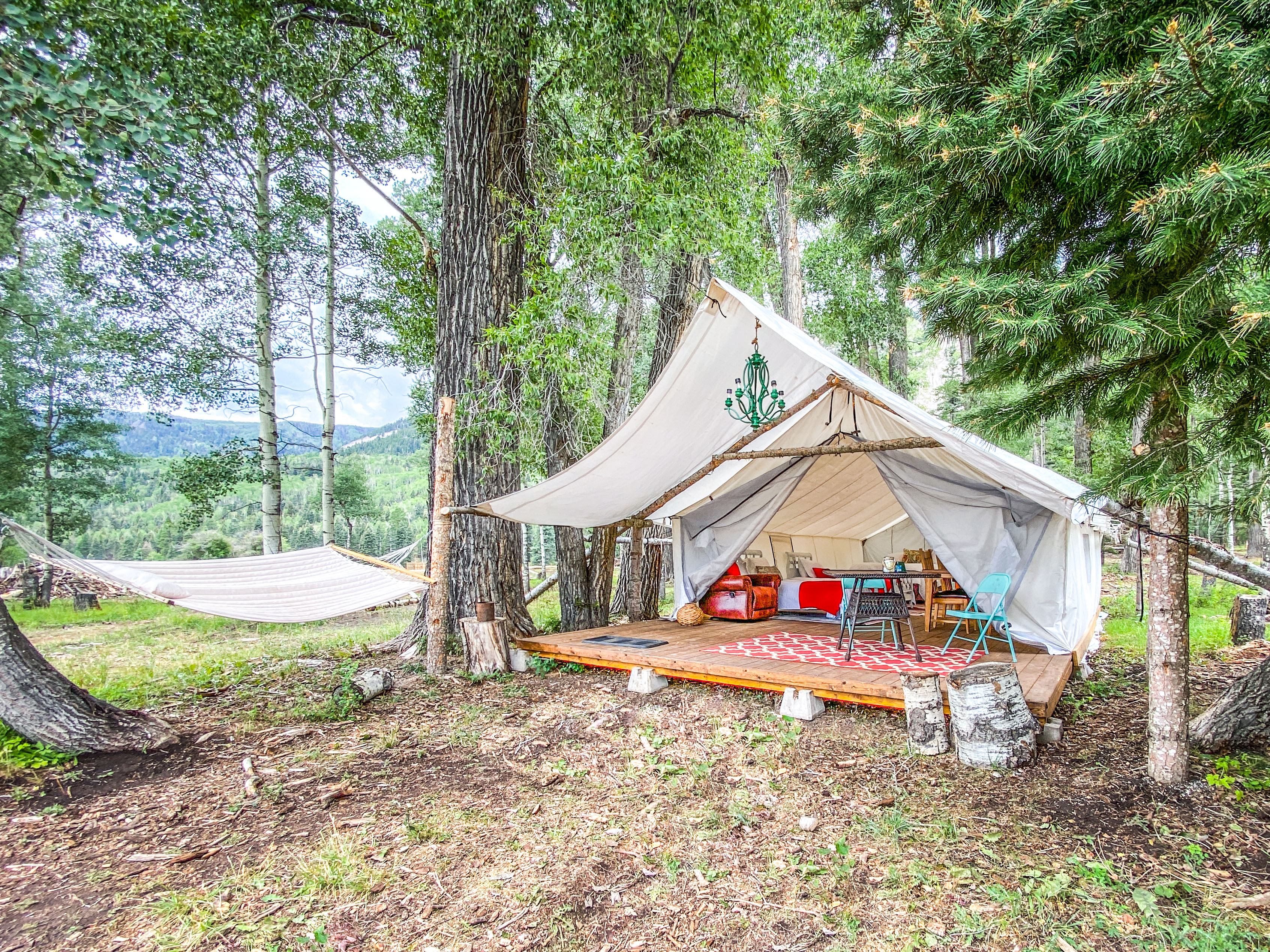 furnished walk-in tents w/ luxury bedding and soft bath towels photo