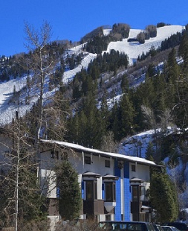st moritz lodge with aspen mountain in the back ground photo