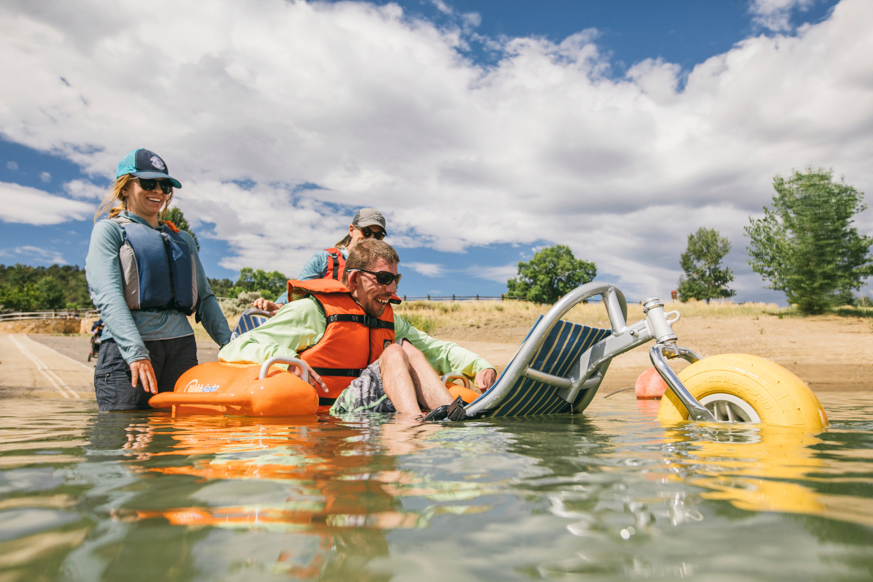 using the mobi-chair floating beach wheelchair at ridgway state park, just some of the accessible tools available. photo 4