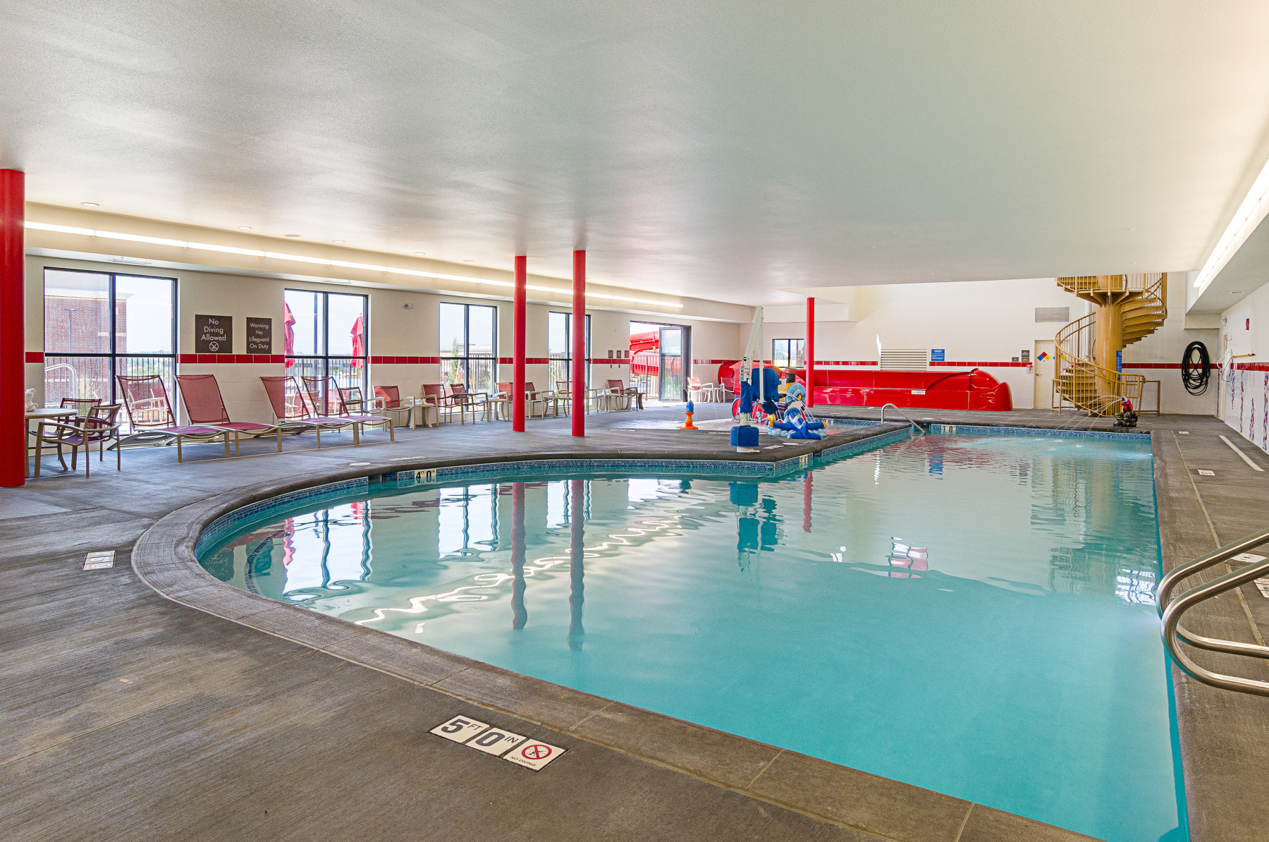 indoor pool with water features and water-slide photo 6