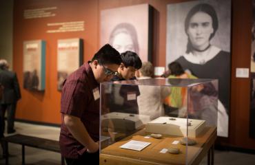 visitors viewing the borderlands of southern colorado exhibit photo