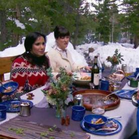 Colorado Top Chef Episode 5 Padma Lakshmi dining outside at a table with snow in the background