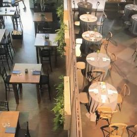 Colorado Top Chef Episode 6 Rows of tables in a restaurant set for a meal