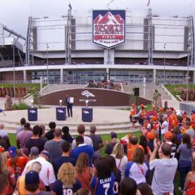 Colorado Top Chef Episode 9 People watching a speaker at a baseball stadium