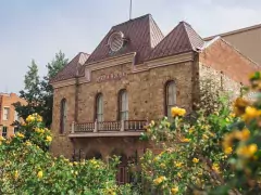 The Central City Opera House is just a 35 minute drive from Denver. Old opera house with flowers in the foreground.