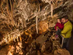father and daughter during cave tour in Glenwood Caverns
