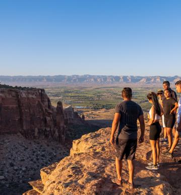 Summer 2020 CFC Hero cropped Family standing on the rim of a canyon admiring mountains