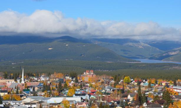 Aerial view of a town with large mountains in the distance