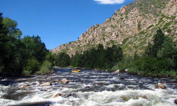 Rafters going down the Cache La Poudre River.