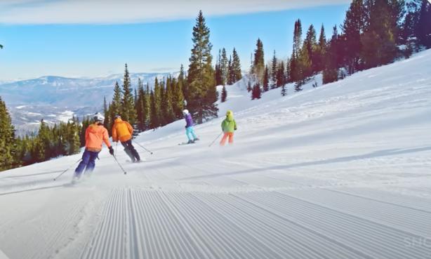 People downhill skiing in Snowmass, Colorado