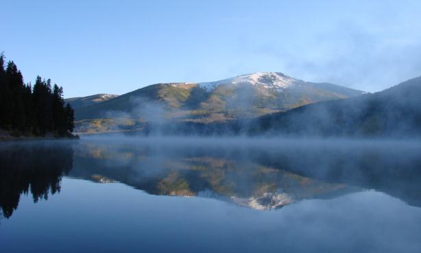 Still lake with the reflection of a mountain