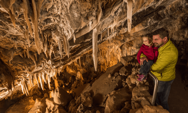 father and daughter during cave tour in Glenwood Caverns