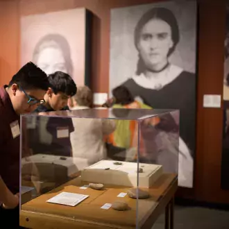 visitors viewing the borderlands of southern colorado exhibit photo