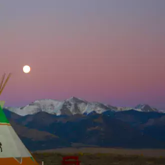 the tipis and a full moon photo