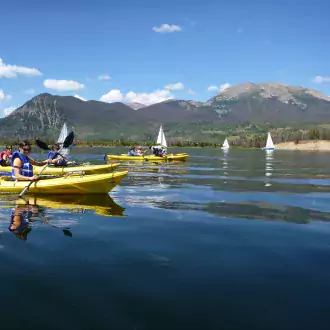 kayaking frisco bay with sailboats in the background photo