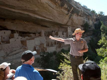 A ranger gives a tour of Ancestral Puebloan cliff dwellings in Mesa Verde National Park - near Cortez, CO