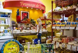 Shelves filled with cheeses from around the world
