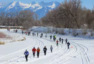 Runners race along the frozen Rio Grande at Alamosa's Rio Frio 5K. 