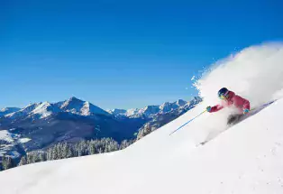 Solo skier on power at Vail Mountain