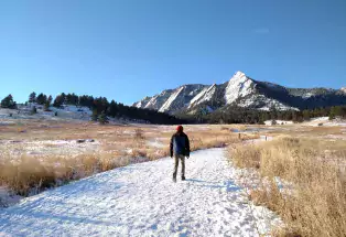 Winter hiker on a trail at Chautauqua Park