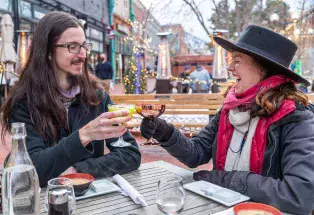 A couple dining outside on Pearl Street