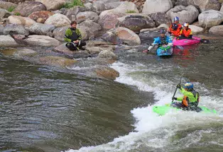 Kayakers taking on a playhole in Buena Vista