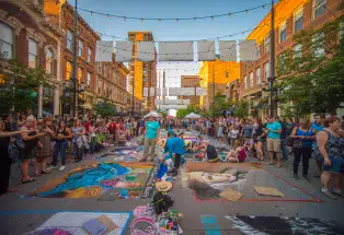 Artists working on the Chalk Art Festival in Larimer Square
