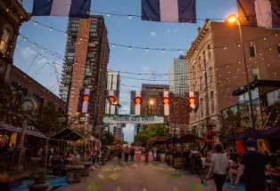 People shopping and dining in Denver's Larimer Square in the evening