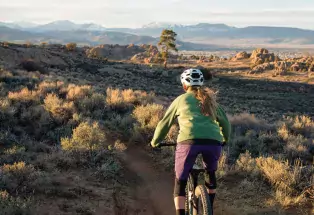 A woman rides the mountain bike trails at Hartman Rocks Recreation Area in Gunnison
