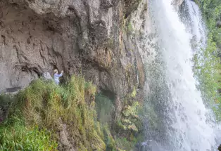 Photographers take photos at Rifle Falls State Park