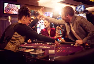 A group plays baccarat at the Monarch Casino Resort Spa Black Hawk